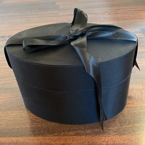 Black oval cushion decorative container